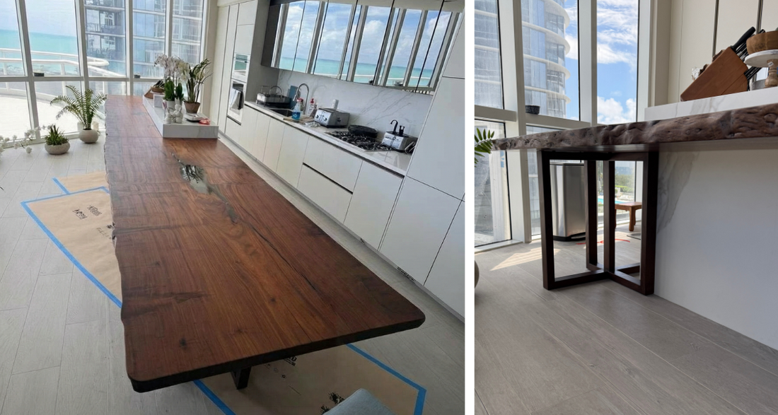 Final table placed in the condo — full length visible with live edge and dark epoxy fills