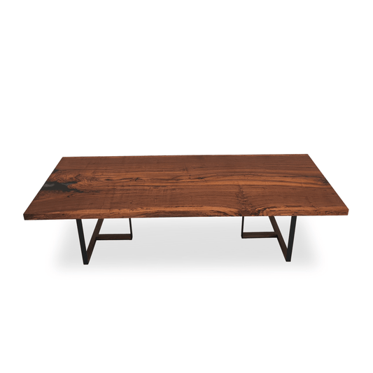 Handcrafted Congo Padauk slab dining table with wooden inserts and straight-edge tabletop.