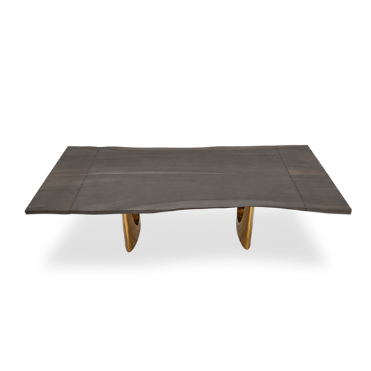 Vault bleached Monkey Pod extendable dining table with live-edge tabletop and golden metal legs.