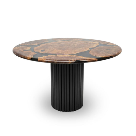 Round wooden table with a black ribbed base on a white background