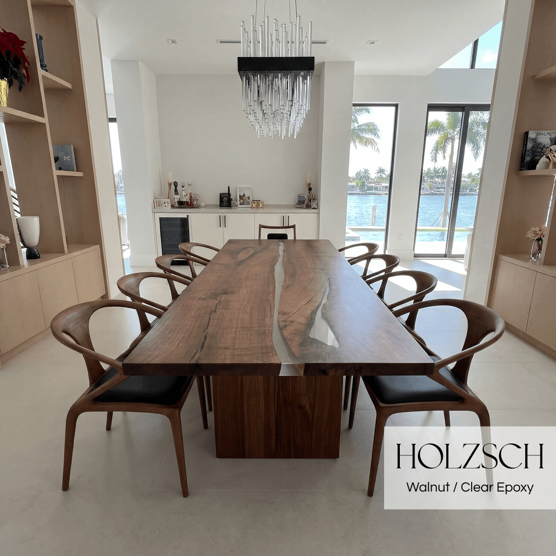 Dining room with a wooden table and chairs, featuring Holzschuh furniture.