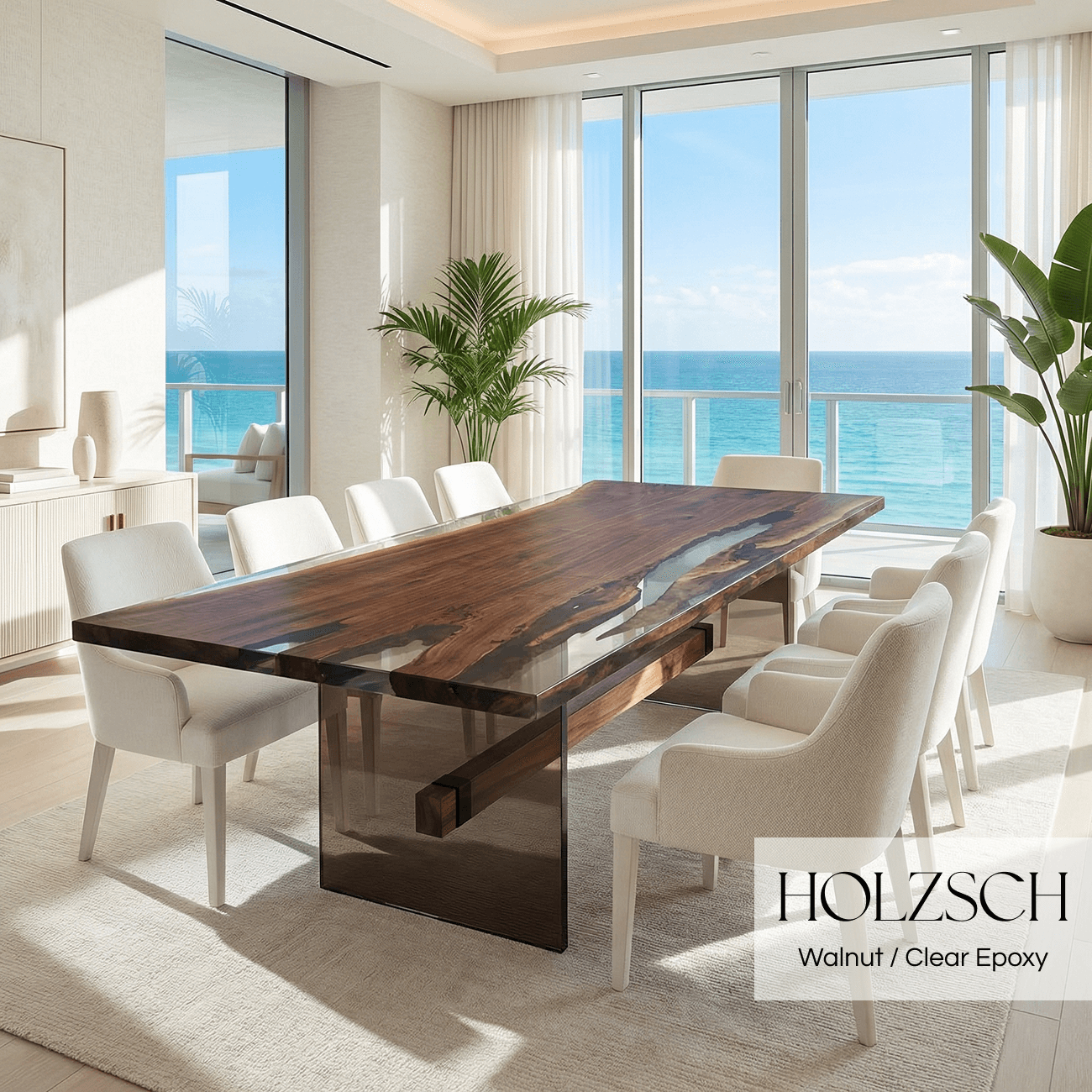 Modern dining room with a wooden table and white chairs, featuring a view of the ocean.