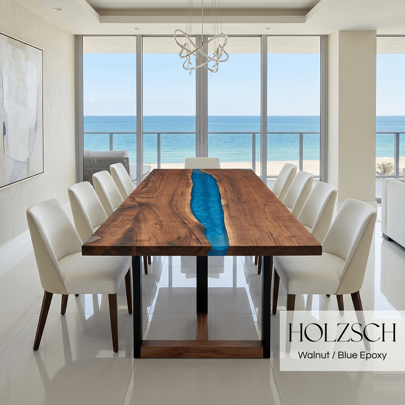 Dining room with a wooden table featuring a blue epoxy runner, surrounded by white chairs, with a view of the ocean.